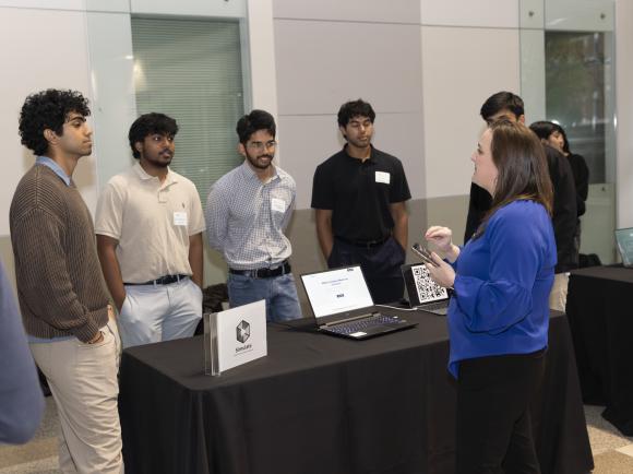 SCI's Jennifer Whitlow speaks with a team presenting at the new entrepreneur section of Junior Design Capstone. Photos by Terence Rushin/ College of Computing.