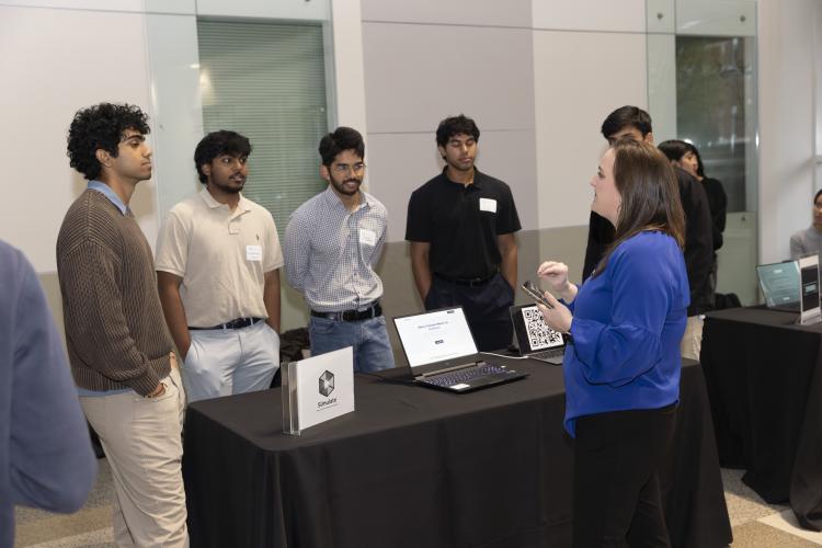 SCI's Jennifer Whitlow speaks with a team presenting at the new entrepreneur section of Junior Design Capstone. Photos by Terence Rushin/ College of Computing.