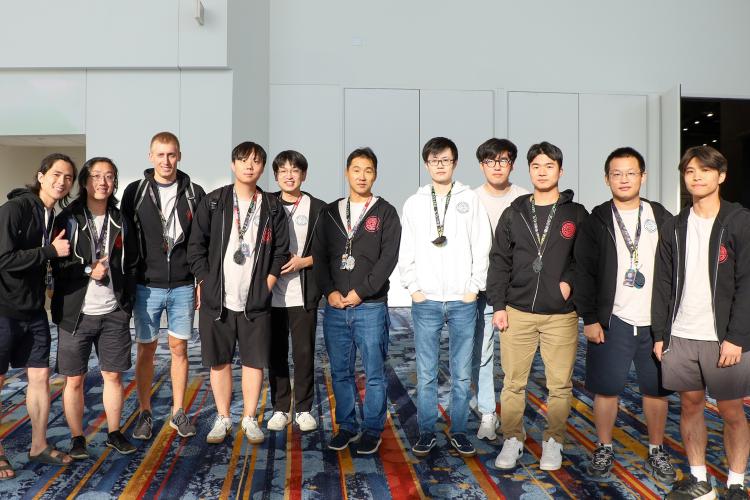 A group photo of Georgia Tech students and a professor 